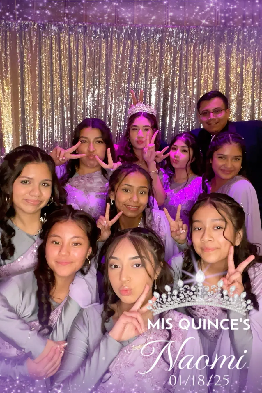 A large group celebrating a quinceañera with a tiara overlay